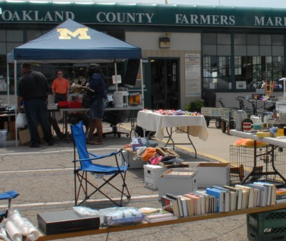 People shopping at the Community Garage Sale at Oakland County Farmers Market.